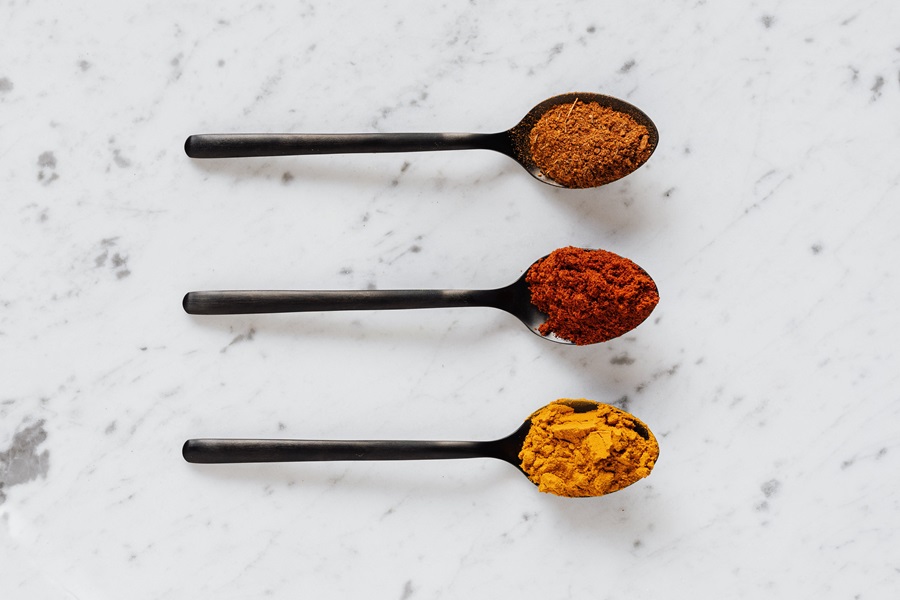 Chili Powder vs Cayenne Three Spoons with Different Seasonings 