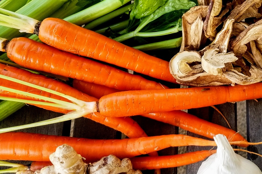 Keto Chicken Bone Broth Recipe Close Up of Carrots, Celery, Mushrooms, Garlic, and Ginger