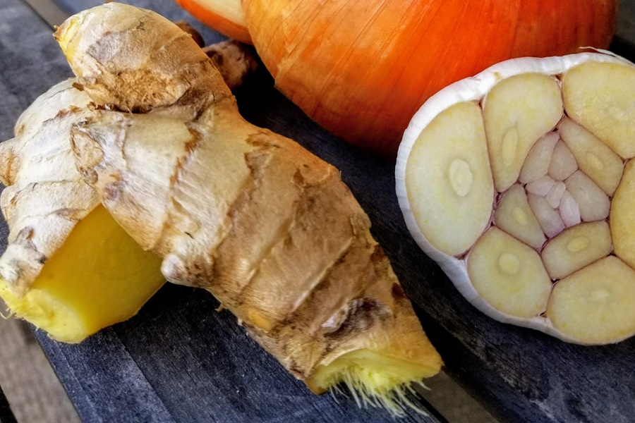 Keto Chicken Bone Broth Recipe Close Up of Ginger and Garlic Cut in Half