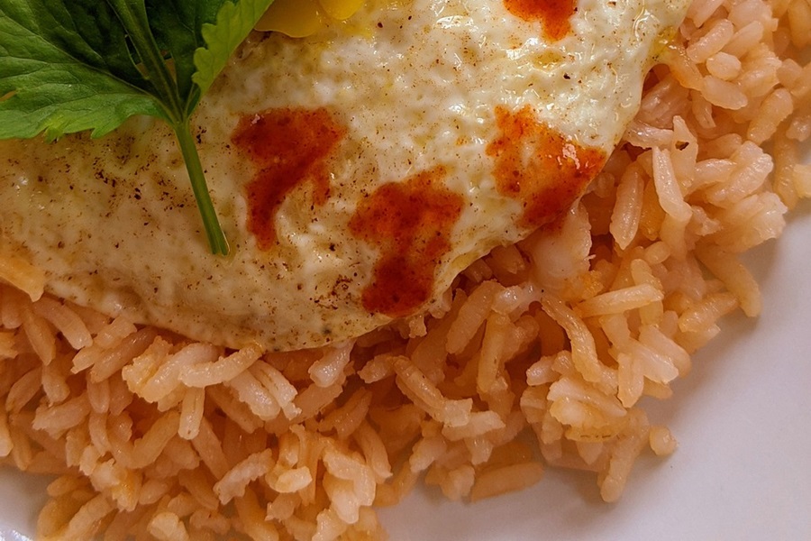 Can You Freeze Spanish Rice Close Up of Spanish Rice Topped with an Egg