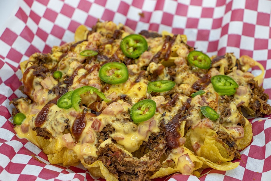 Mexican Barbacoa Recipe Ideas a Plate of Nachos with Cheese, Shredded Meat, and Jalapenos