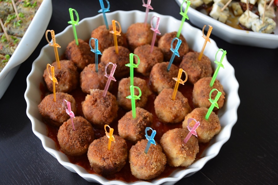 How to Cook Frozen Uncooked Meatballs a Serving Tray of Meatballs with Little Sword Toothpicks in Each One