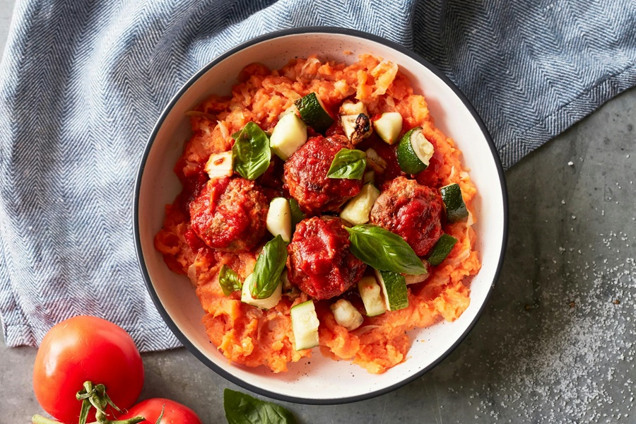 How to Cook Frozen Uncooked Meatballs a Bowl of Four Meatballs in a Sauce with Cheese and Basil Leaves