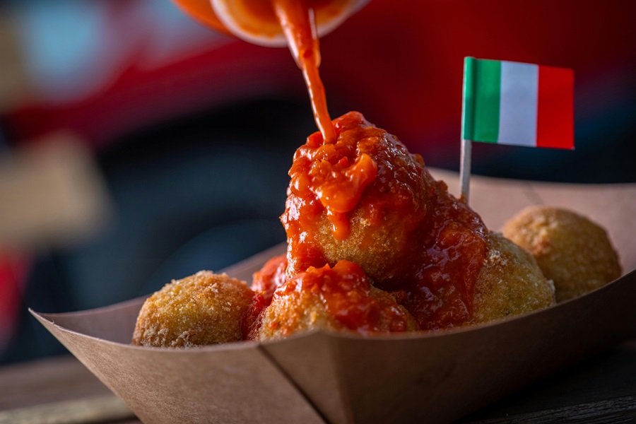 How to Cook Frozen Uncooked Meatballs a Small Cardboard Container with Meatballs and a Red Sauce Over Them
