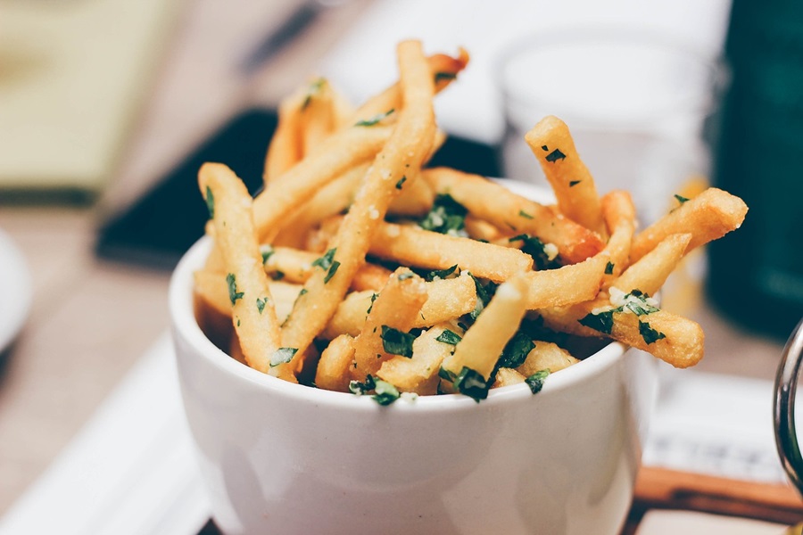 Can You Put Paper Towel in an Air Fryer Close Up of a Small Bowl of Fries with Parsley and Garlic