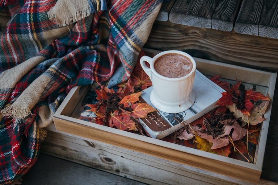 Keurig K525 vs K575 a Cup of Hot Chocolate on a Serving Tray Next to a Plaid Blanket