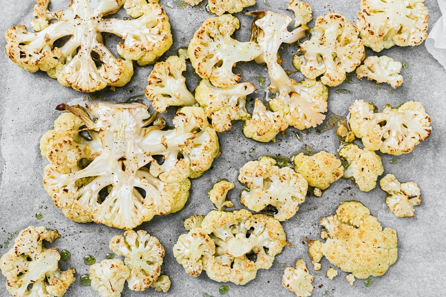 Cauliflower Air Fryer Recipes Roasted Cauliflower on a Baking Sheet Lined with Parchment Paper