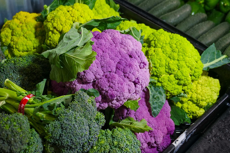 Cauliflower Air Fryer Recipes Purple and Green Cauliflower Heads Stacked Together