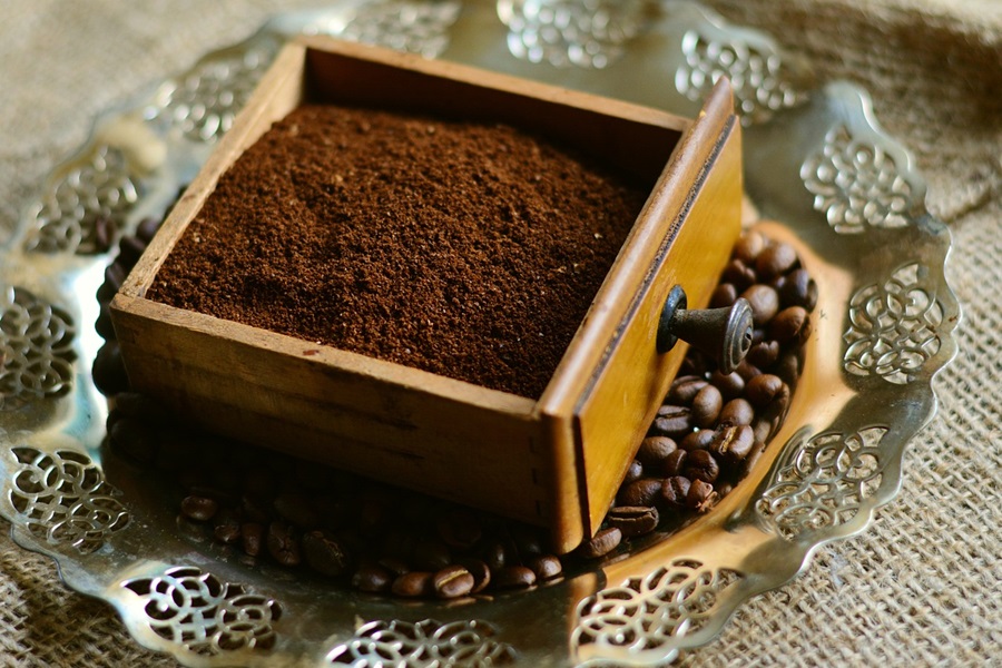 What Dissolves Coffee Grounds a Small Wooden Box Filled with Coffee Grounds