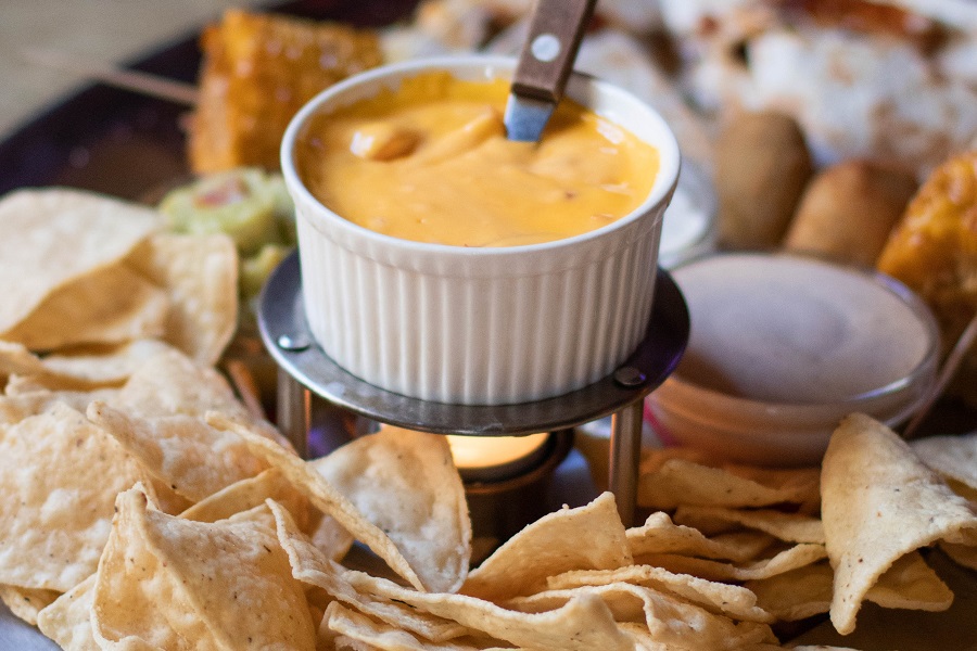 Recipes with Queso Dip Close Up of a Party Platter with Chips and a Queso Dip in the Middle