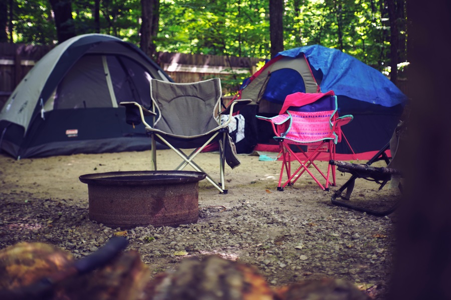 Cast Iron Cooking Recipes View of a Campsite with Two Tents, Chairs, and a Fire Pit