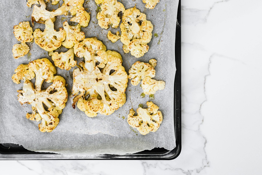 Instant Pot Cauliflower Recipes a Baking Tray of Roasted Cauliflower Halves