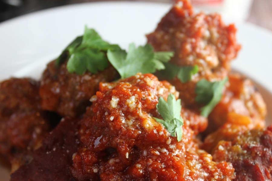 Easy Crockpot Meatballs Dinner Recipe Close Up of Italian Meatballs on a White Plate