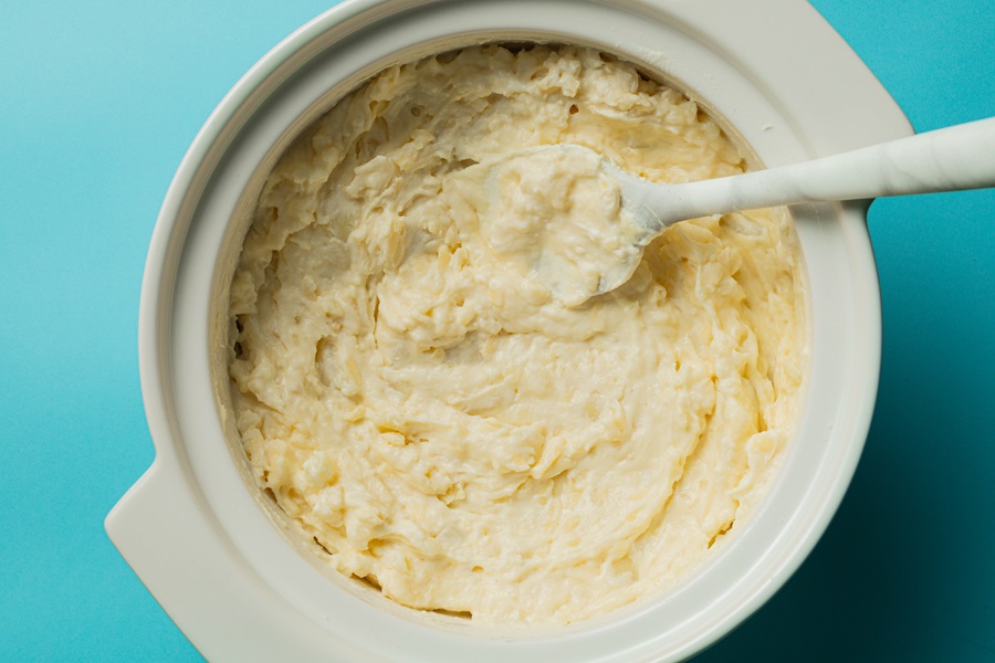 Easy Twice-Baked Mashed Potatoes Recipe Close Up of Mashed Potatoes with Cream Cheese and Milk Mixed in