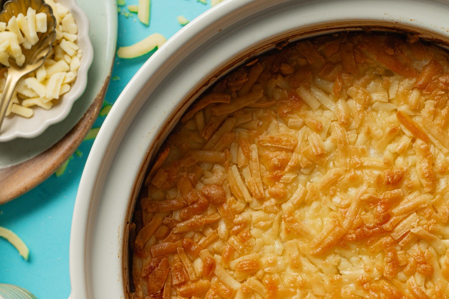 Easy Twice-Baked Mashed Potatoes Recipe Close Up of Melted Cheddar Cheese in a Baking Dish