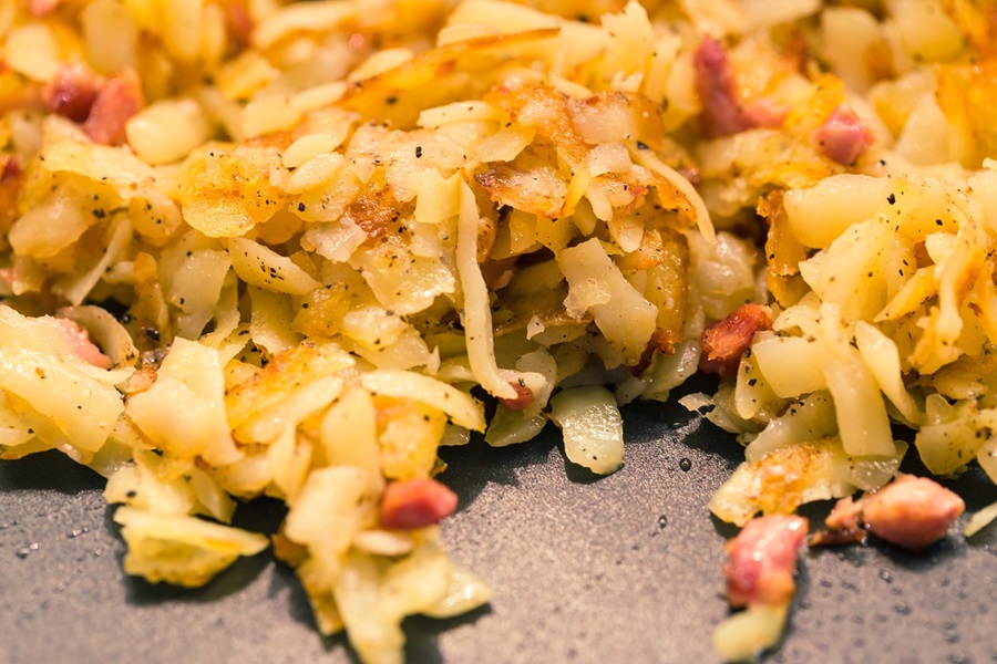 Veggie Hashbrown Casserole Breakfast Recipes Close Up of Potatoes on a Griddle Cooking