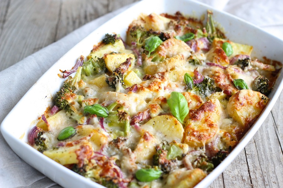 Veggie Hashbrown Casserole Breakfast Recipes Close Up of a Casserole Dish Filled with Potatoes, Broccoli, and Cheese