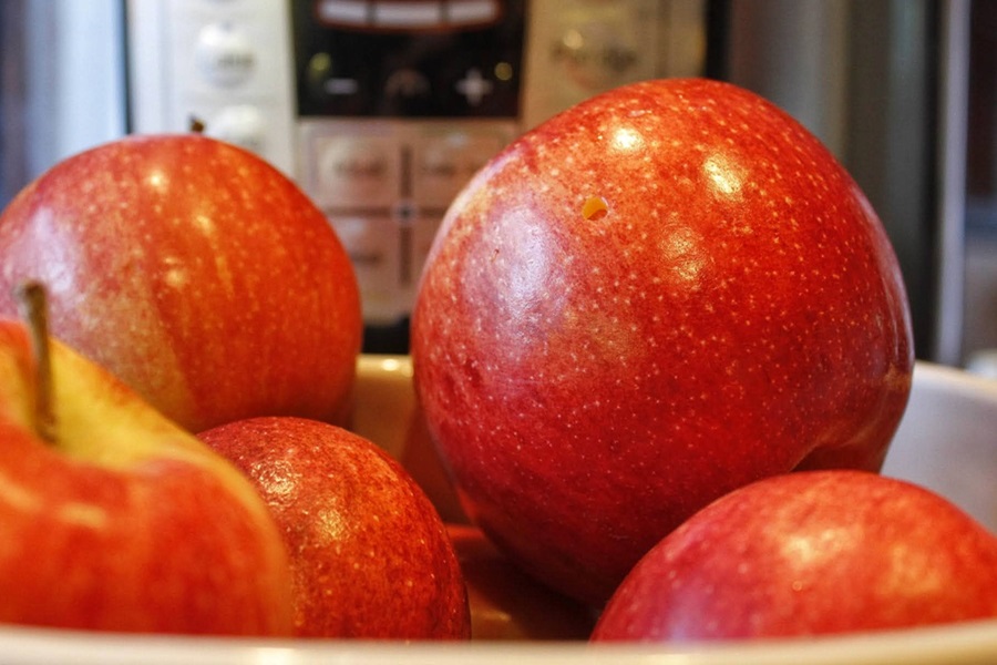 Faster than Stovetop Instant Pot Cinnamon Apples Recipe Red Apples with an Instant Pot in the Background