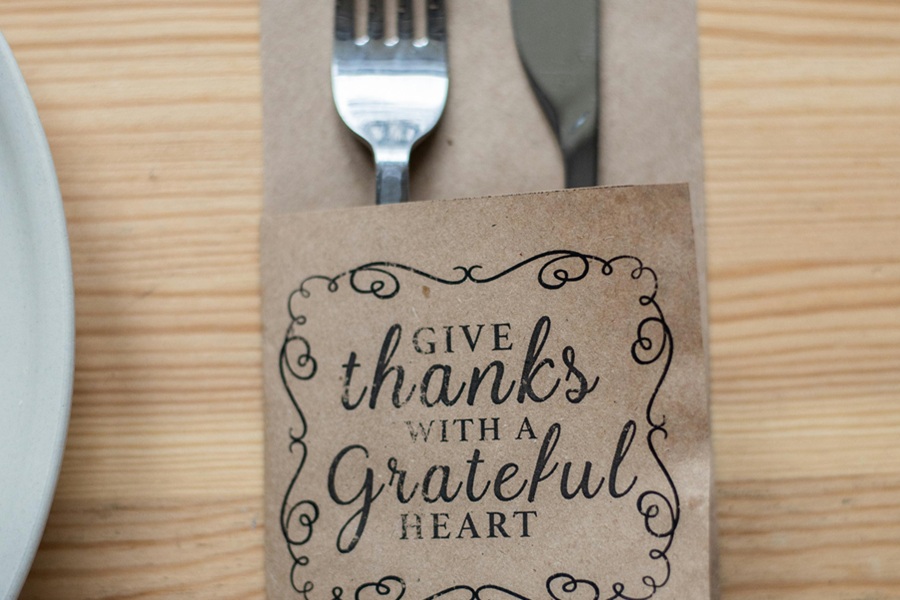 Vegan Thanksgiving Appetizers Close Up of a Table Setting with a Card That Says Give Thanks with a Grateful Heart