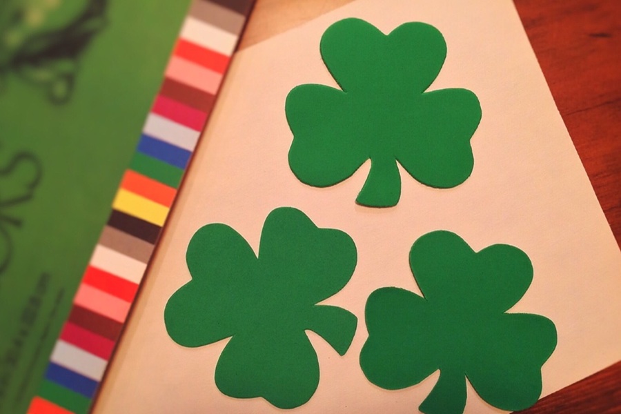 St. Patrick's Day Food Snack Ideas Close Up of Paper Shamrocks on a Crafting Table