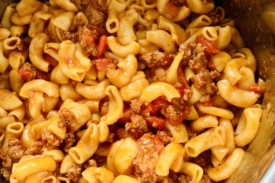 Easy Goulash in the Instant Pot Close Up of Macaroni, Ground Beef, and Diced Tomatoes in an Instant Pot