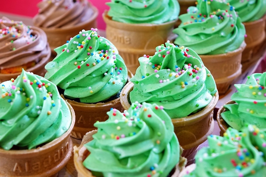 St Patricks Day Cupcake Recipes Cupcakes in Ice Cream Cones with Green Frosting and Sprinkles