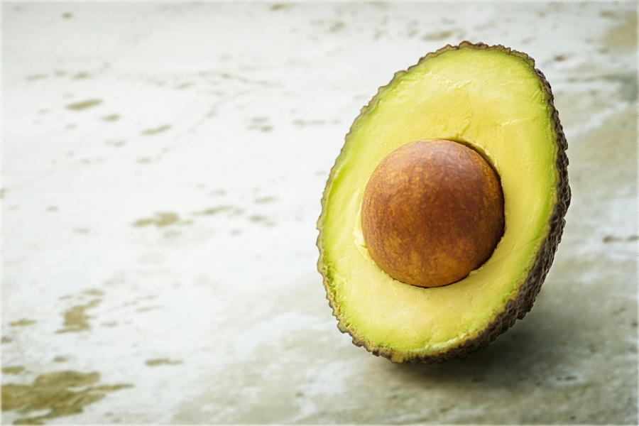 Chicken Tacos Crockpot Recipe Close Up of an Avocado Cut in Half