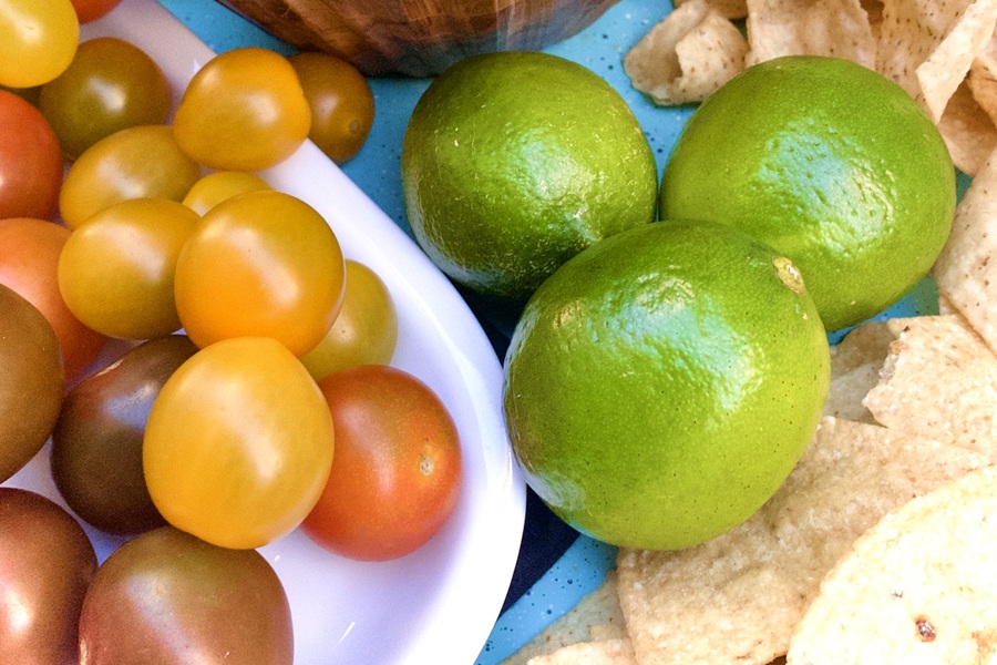 Salsa without Onions Recipe Close Up of Tomatoes, Limes, and Chips on a Platter