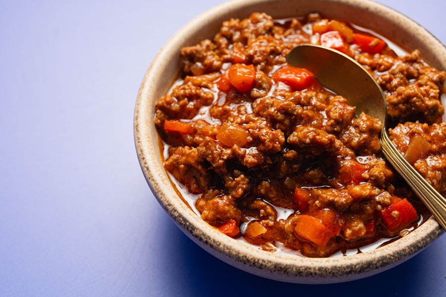 Crockpot Sloppy Joes Recipe Meat Mixture in a Bowl with a Spoon