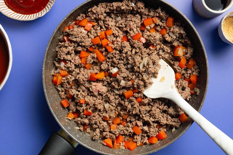 Crockpot Sloppy Joes Recipe Meat Mixture Cooked with Tomatoes and Onions in a Pan