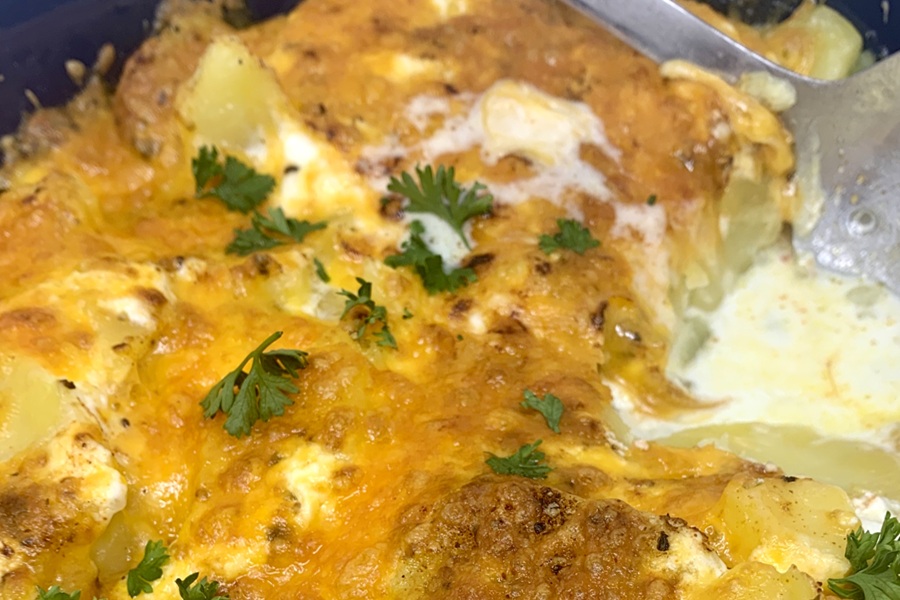 Easy Instant Scalloped Potatoes with a Serving Taken Out Inside an Instant Pot