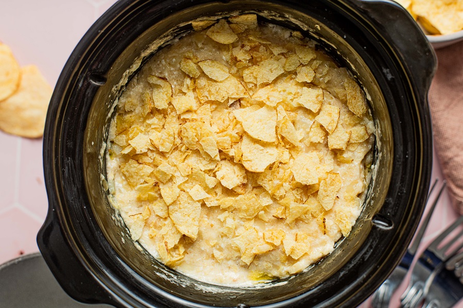 Cheesy Crockpot Hashbrown Potatoes Recipe Casserole Inside Topped with Chips