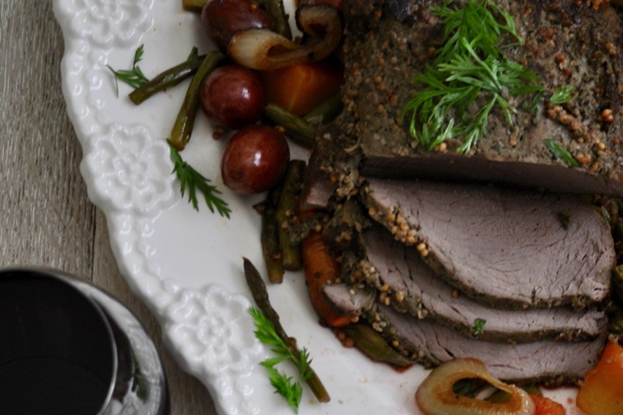 Crockpot Beef Pot Roast Recipe Close Up of Sliced Roast on a Serving Platter with Roasted Veggies